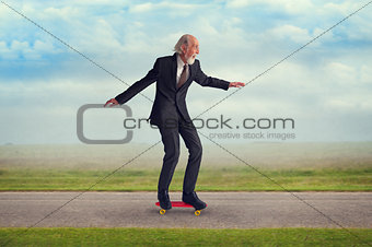 senior man riding a skateboard
