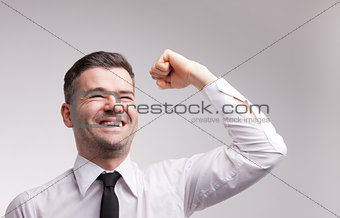 happy man exulting raising his arm