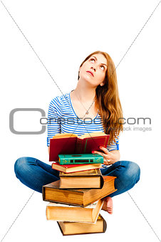 thoughtful student and pile of books