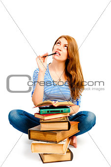 Meditate beautiful student with a pile of books