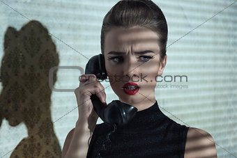 girl with phone and dramatic expression 