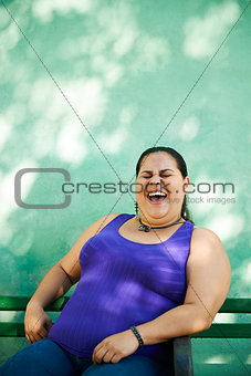 Portrait of fat woman looking at camera and smiling