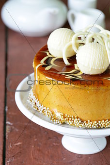 festive beautiful caramel biscuit cake decorated with white chocolate