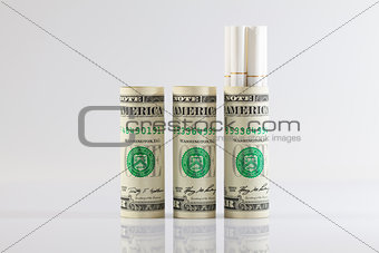 Rolls of dollar bills and a long cigarettes