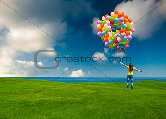 Girl with colorful balloons