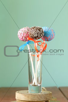 Variety of colorful cake pops - chocolate, vanilla and caramel flavors