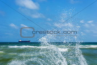 Ð¡argo ship and splashing waves