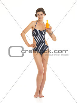 Full length portrait of happy young woman in swimsuit showing bo