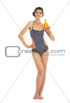 Full length portrait of happy young woman in swimsuit showing bo