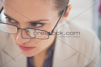 Closeup on business woman wearing eyeglasses