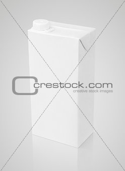 Blank white carton package of juice on gray