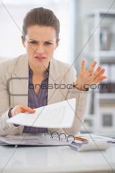 Portrait of frustrated business woman at work