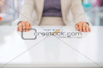 Closeup on business woman in front of document