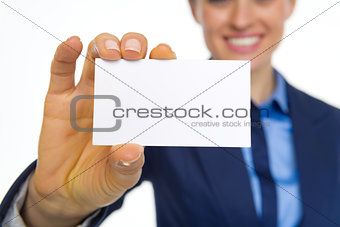 Closeup on happy business woman showing business card