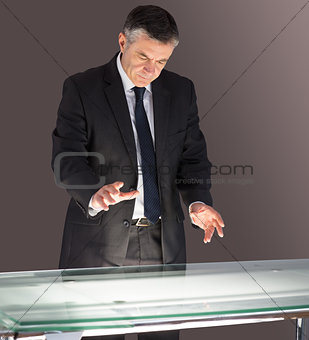 Concentrating businessman looking at desk