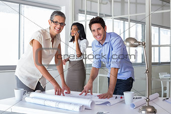 Attractive architects going over plans
