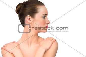 Natural beauty posing with hands on shoulders