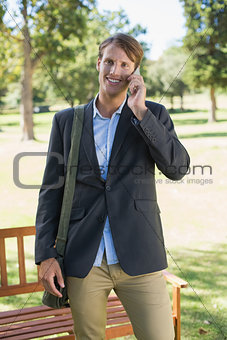 Casual businessman talking on smartphone in park
