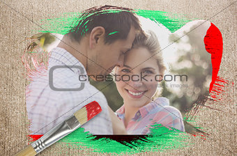 Composite image of happy couple in the countryside