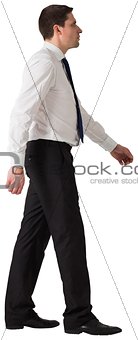 Handsome businessman in shirt and tie stepping