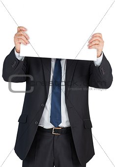 Mature businessman showing blank card