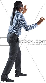 Blindfolded businessman with arms out