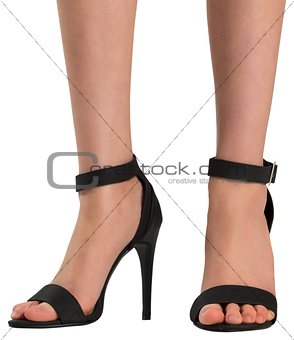 Female feet in black sandals