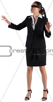 Blindfolded businesswoman with hands out