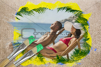 Composite image of couple lying on the beach