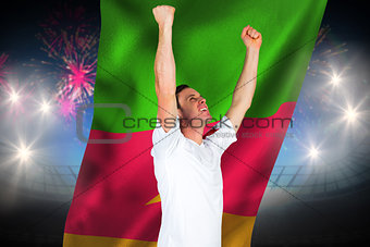 Composite image of cheering football fan in white