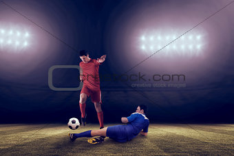 Composite image of football players tackling for the ball