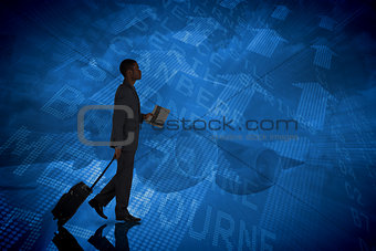 Composite image of young businessman pulling his suitcase