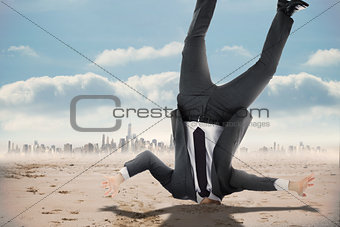 Composite image of businessman burying his head