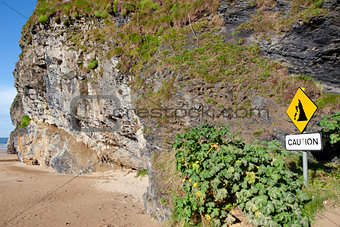 amber cliff falls warning sign