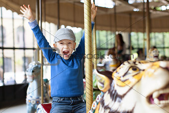 boy at carousel