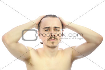 Caucasian man  with arms behind his head