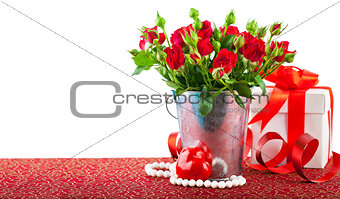 Bunch red roses with gift and heart