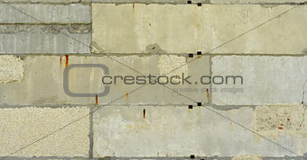 Old, cracked surface of concrete and bricks