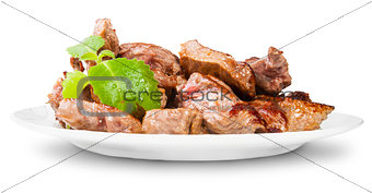 Grilled Meat On A White Plate Rotated Served With Mint Leaf