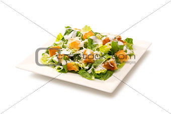 Caesar salad in a white plate