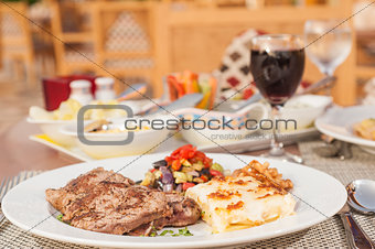 A la carte steak meal on patterned plate