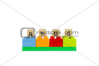 abcd word on wood stamps and colorful toy blocks