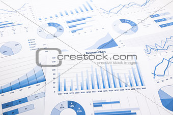 blue business charts, graphs, reports and paperwork