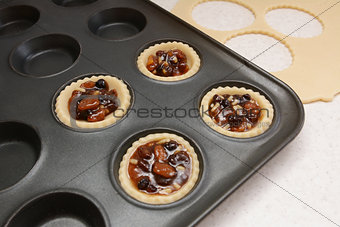Four pastry cases filled with mincemeat
