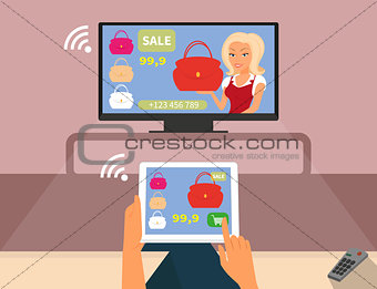 Multiscreen interaction. Woman is purchasing red bag online in TV shop using tablet pc