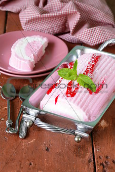 strawberry vanilla cake roll ice cream with mint and berry sauce