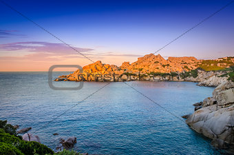 Ocean rocky coastline colorful sunset view, Sardinia