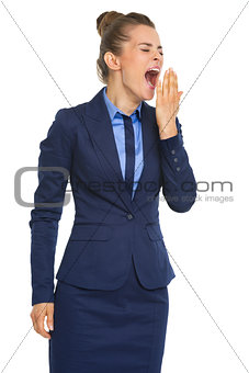 Tired business woman yawning