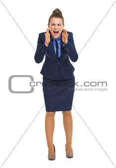 Full length portrait of angry business woman shouting through me