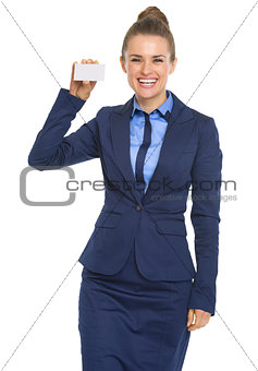 Portrait of smiling business woman showing business card